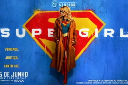 milly-alcock supergirl in-front-of-supergirl-logo